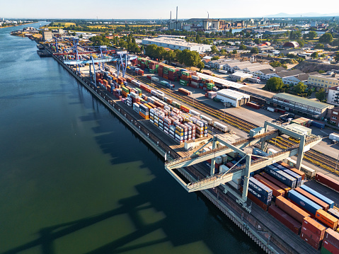 arial view on cargo container harbor at riverside in Mannheim at sunny morning, Mannheim has the second biggest inland harbor of europe
