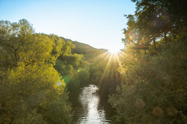 view on Lahn River in Marburg in the backlit of late afternoon sun