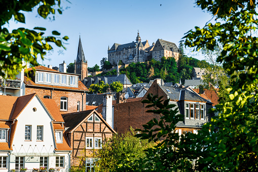 view on historic Marburg over Lahn river at blue summer morning with castle in the background