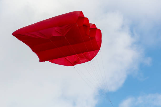 istock Red parachute in the sky 2151229397