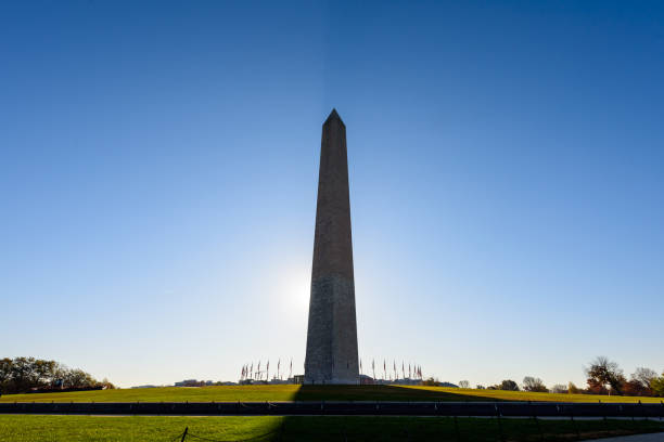 istock Washington Monument with the sun behind, Washington, D.C., in the winter. 2151232373