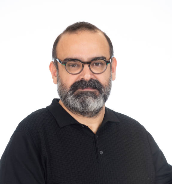 istock Portrait of serious man on white background 2151233401
