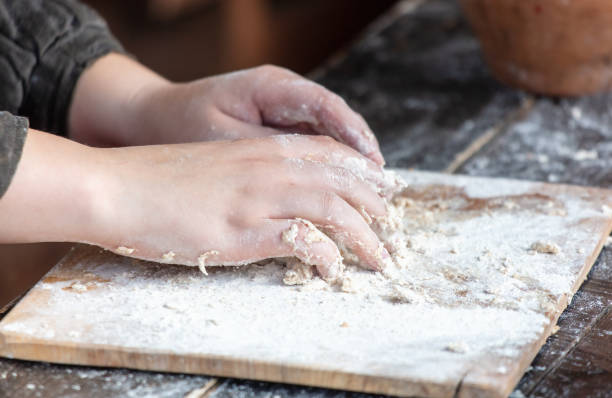 istock A woman kneads the dough with her hands 2151235462