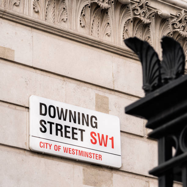 Close up of a sign for Downing Street in Westminster, London, the location of the UK Prime Minister's official residence.
