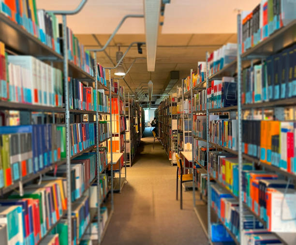 istock Public library and bookshelves with literature. Blurring the background image 2151237012