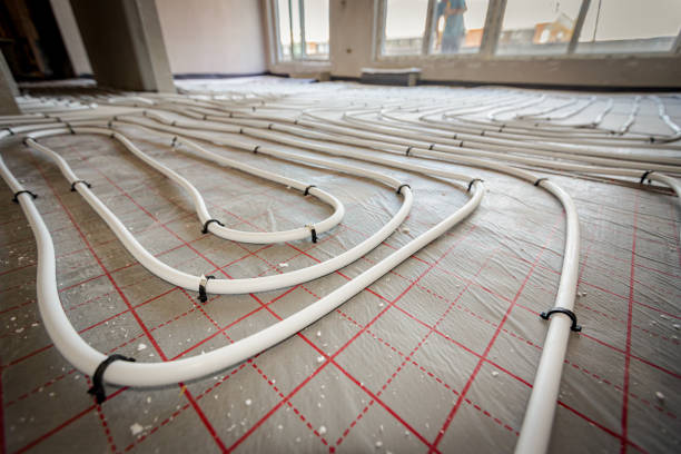 istock Pipe system of floor heating mounted in residential building under construction 2151239170
