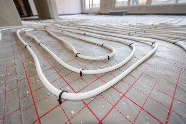 istock Pipe system of floor heating mounted in residential building under construction 2151239173