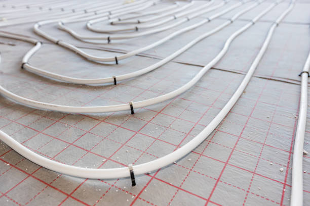 istock Pipe system of floor heating mounted in residential building under construction 2151239175
