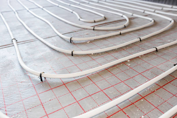 istock Pipe system of floor heating mounted in residential building under construction 2151239180