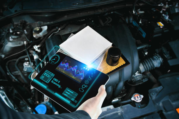 istock Car mechanic checking ECU electronic control unit with OBD or OBD2 wireless scanner tool 2151239588