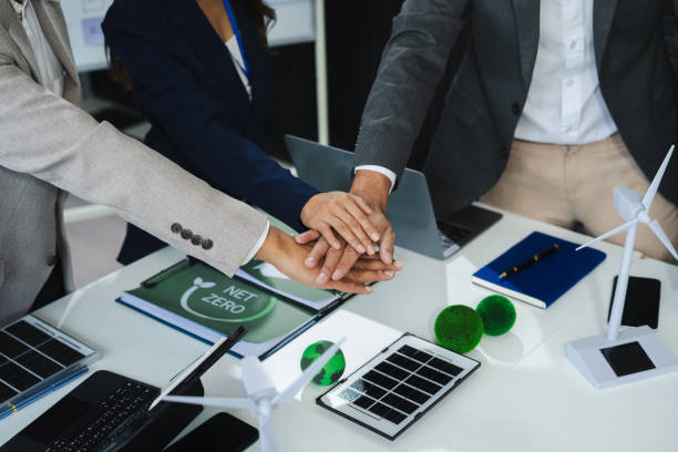 istock business people holding each others wrists, join hands together, support and unity, team strength and power, colleagues involved in team building activity. 2151241108