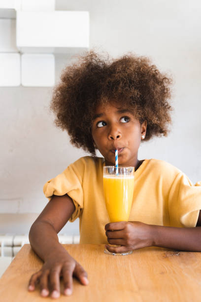 istock Girl drinking juice 2151241225