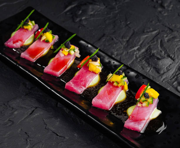 istock Gourmet tuna sashimi on black slate plate 2151241483