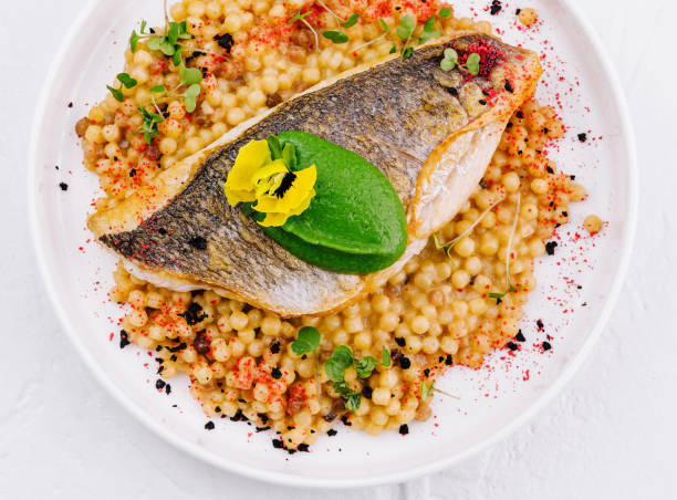 istock Grilled salmon fillet with herb couscous on plate 2151242152