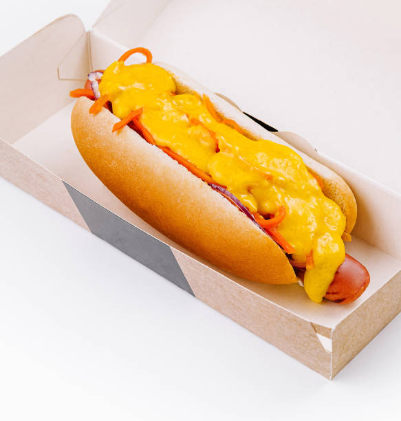 istock Cheesy hot dog in takeaway box on white background 2151242210
