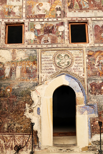 The entrance door to the Rock Church at the Sumela, Sümela Monastery, surrounded by colorful frescos, Trabzon, Turkey 2022