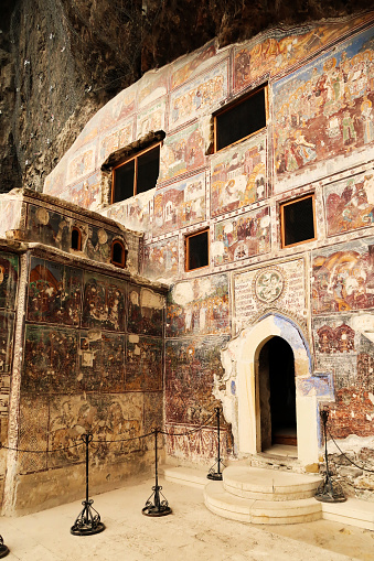 The beautiful front facade of the Rock Church at the Sumela, Sümela Monastery, completely covered in colorful frescos, Trabzon, Turkey 2022