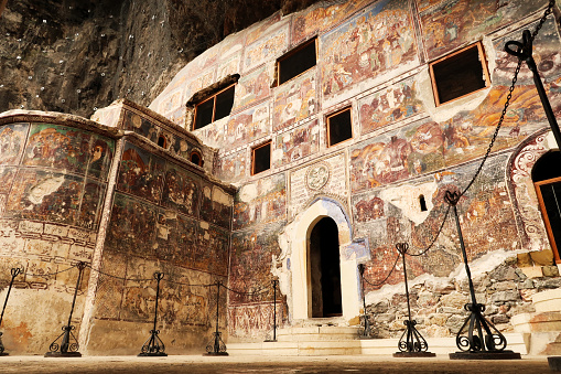 The impressive front facade of the Rock Church at the Sumela, Sümela Monastery, completely covered in colorful frescos, Trabzon, Turkey 2022