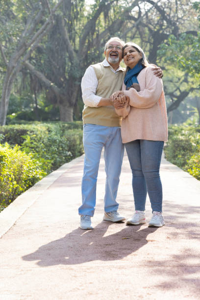 istock Happy senior couple spending leisure time in park. 2151244389