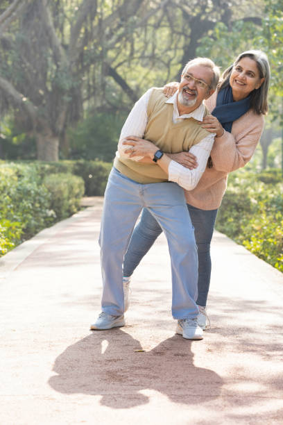 istock Happy senior couple spending leisure time in park. 2151244515