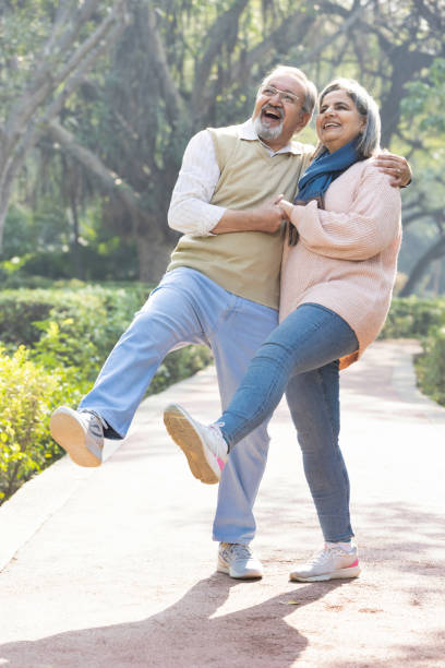 istock Happy senior couple spending leisure time in park. 2151244516