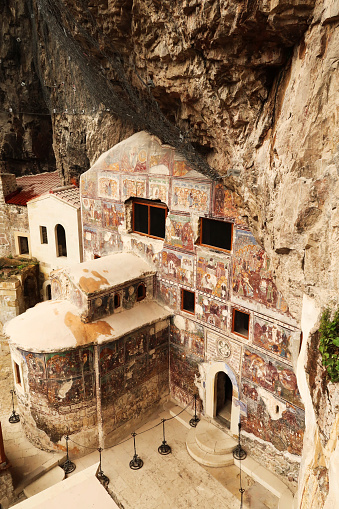 View from above onto Rock Church and its colorful facade, completely covered in christian frescos at the Sumela, Sümela Monastery, Trabzon, Turkey 2022