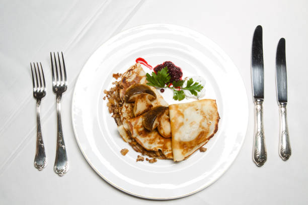 istock White mushrooms with pancakes. Maslenitsa. 2151244931