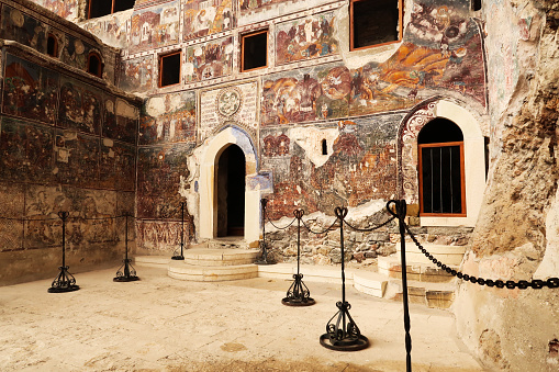 The front facade of the Rock Church at the Sumela, Sümela Monastery, completely covered in colorful frescos, Trabzon, Turkey 2022
