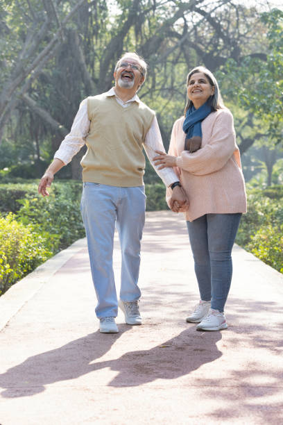 istock Happy senior couple spending leisure time in park. 2151245175