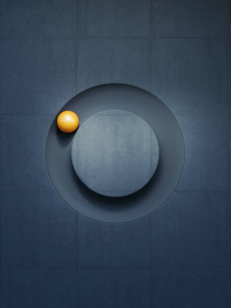 Yellow sphere moving in a circle carved onto a dark concrete background.