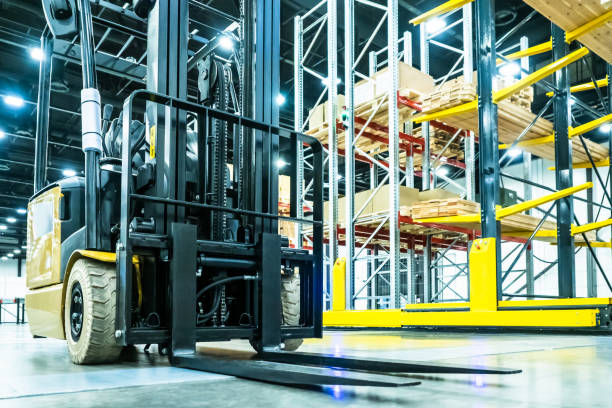 istock Forklift truck Stock. Loading goods. Cargo storage. Logistics. Forklift on the background of racks. Shelves in stock. Tiered shelving. 2151247088