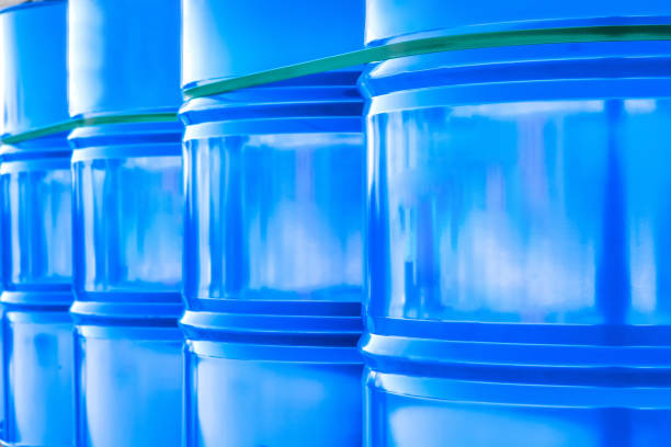 Plastic barrels close-up. Containers are connected to each other. Barrels for shipment from stock. Transportation of chemicals in barrels. Plastic packaging for chemicals. Chemical industry.