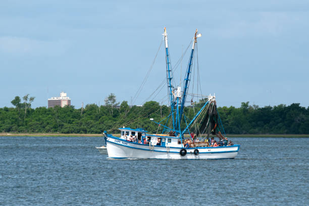 A fishing trawler is docked in the Sandwich, Massachusetts marina boat basin off the Cape Cod canal on a February afternoon.