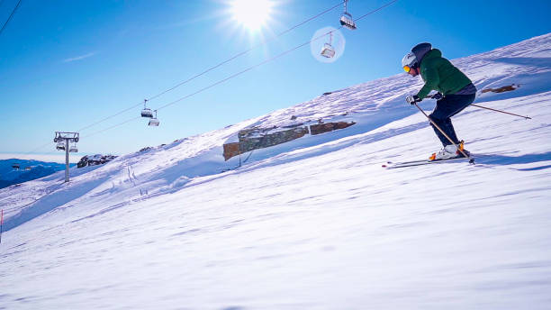 Active lifestyle,  Vital senior men, Happy snow skier, skiing, enjoying on sunny ski resorts.  Snowcapped mountain  Ski resort Dolomiti superski, Sellaronda, Dolomite - Italian Alps,  italy, Europe.