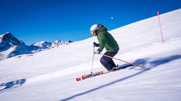 istock Professional ski instructor speed skiing on Italian Alps (Monte Rosa) 2151247839