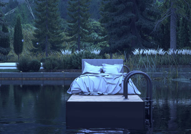 istock white bed on a lake in the mountains. 2151248318