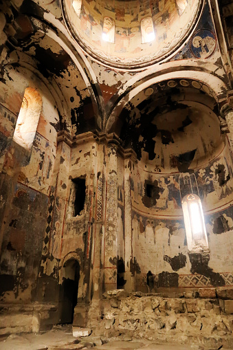 The colorful interior of the Church of Saint Gregory the Illuminator, Tigran Honents, walls, vaults and the dome are completely covered in frescos, wall, ceiling paintings, at the ancient armenian city of Ani, close to Kars, Turkey 2022