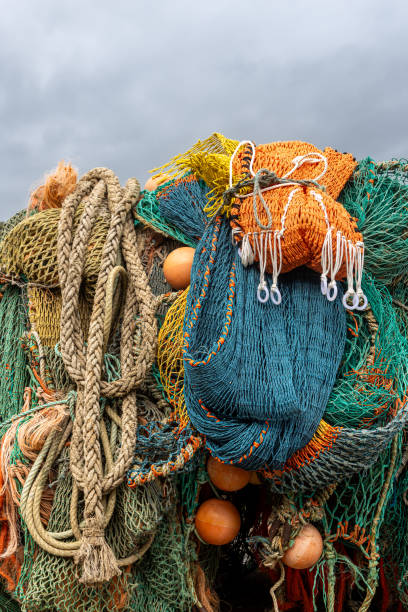 istock Fishing nets and ropes piled up at a harbour in Dorset 2151252125