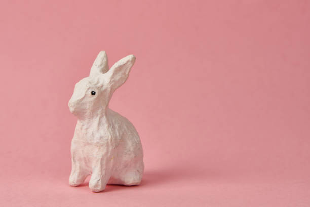 istock Easter bunny on a pink background toy animal holidays 2151252204