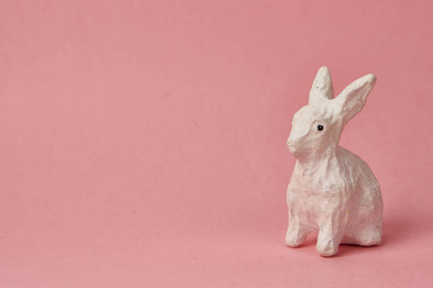istock Easter bunny on a pink background toy animal holidays 2151252310