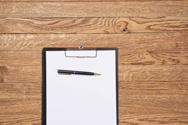 istock Notepad with pen stationery accessories beige background 2151252708