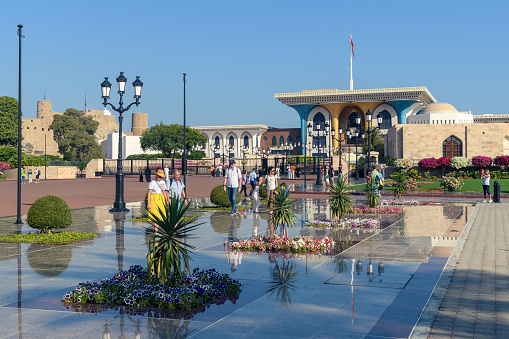 Muscat, Oman - January 2, 2024: The beautiful square in front of the Al Alam Palace, a perfect blend of architectural grandeur and natural beauty.