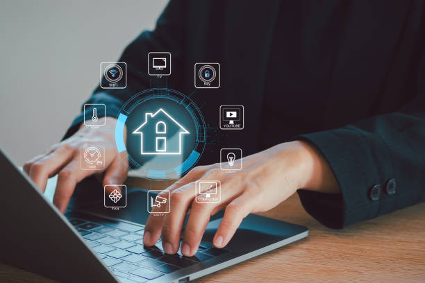 istock Smart home control concept. remote home control online home automation system. Businessman touching smart home icon on virtual screen. 2151254027