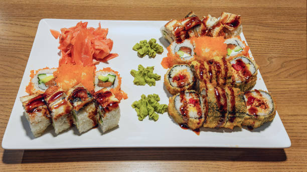 istock Salmon and other fish sushi rolls on a tray 2151256498