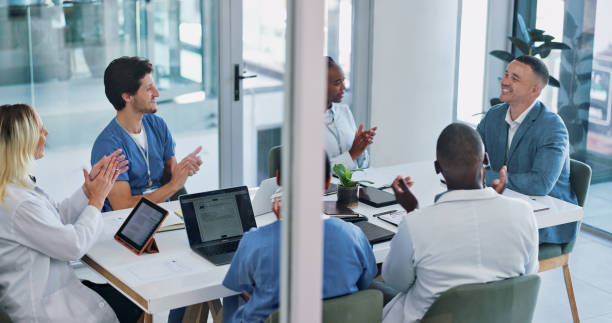 istock Doctors, nurses or office meeting applause for medical, event or b2b onboarding celebration. Health, success and team clapping for news or Alzheimer progress, dementia or clinical research support 2151258842