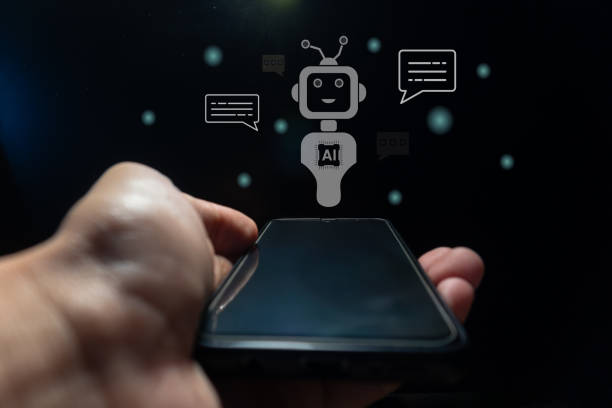 istock Hand holding a smart phone with virtual screen of artificial intelligence robot or chatbot technology concept. 2151261777