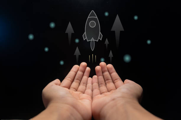 istock Hands with a rocket and arrow up. Business development, financial plan and strategy concept. 2151261846