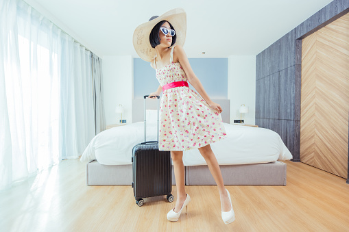 The hotel provided a luxurious retreat for the female tourists, where they could unwind and relax in their favorite dresses, neatly stored in their suitcases.