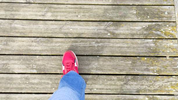 istock Man walks on a wooden platform. First person view video 2151263554