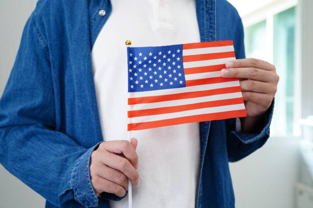 istock Learning English, Asian teenage student holding flag for language program education. 2151268319